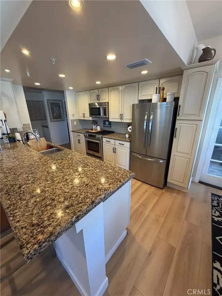 Property Photo:  4591 Warner Ave. 105  CA 92649 