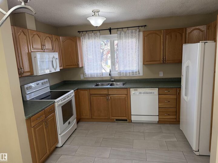 Property Photo:  9561A 180A Street NW  AB T5T 2Z4 