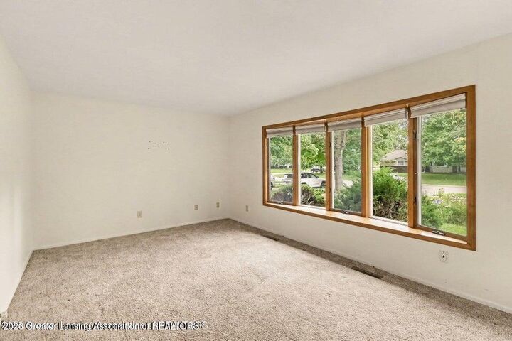 Property Photo:  117 Woodhaven Drive  MI 48917 