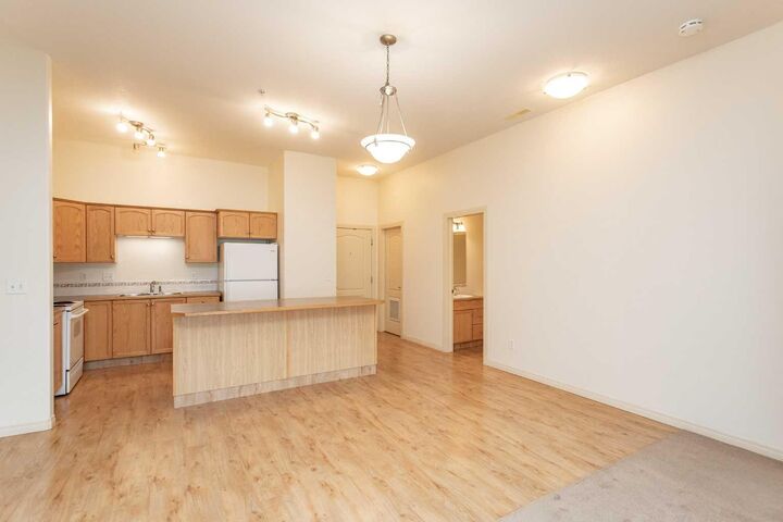 Property Photo: 4425 Heritage Way 105 AB T4L 2P4