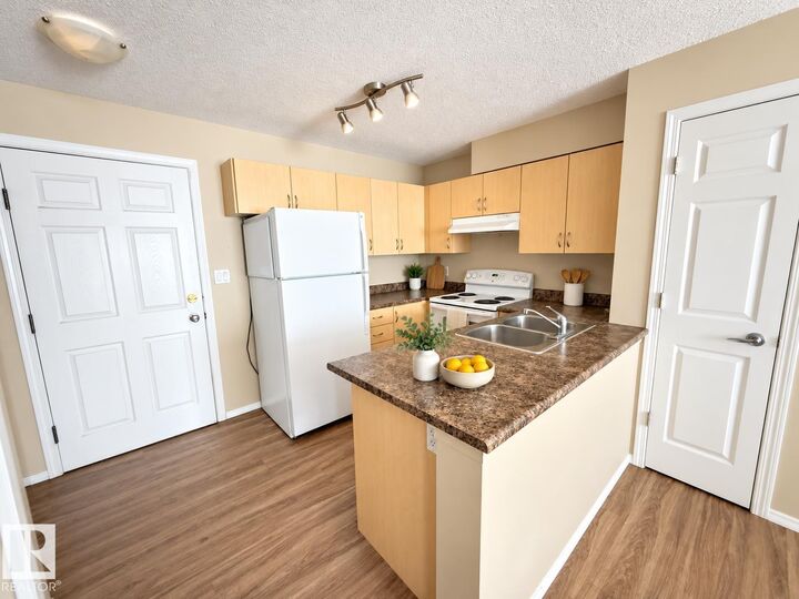 Property Photo: 42 Summerwood Boulevard 310 AB T8H 0C3