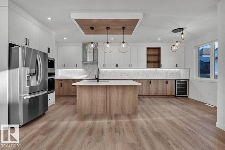 Property Photo: 1115 Gyrfalcon Crescent NW AB T5S 0S1