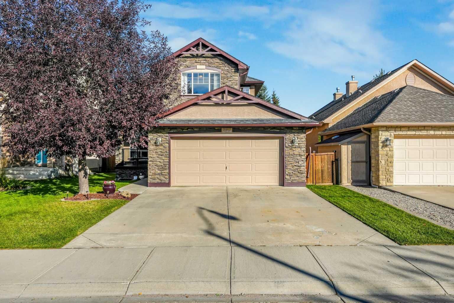 Property Photo:  247 Crystal Shores Drive  AB T1S 2C5 