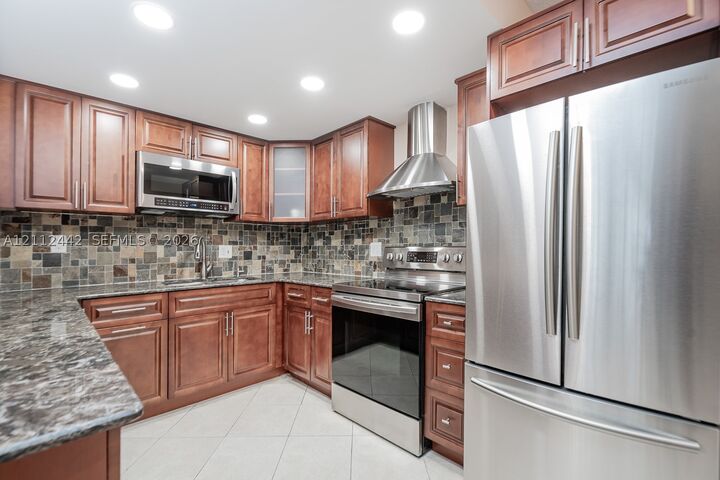 Property Photo:  2455 NE 51st St E114  FL 33308 