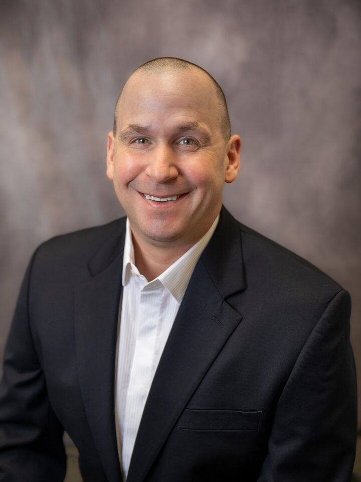 Mark Holcomb,  in Lansing, Affiliated