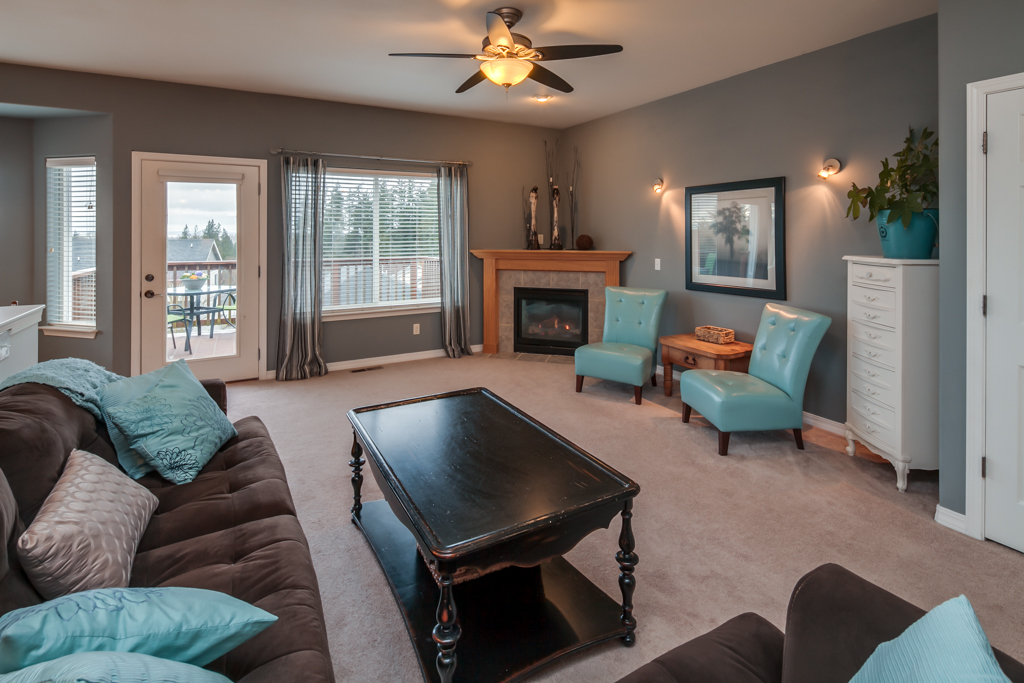 Property Photo: Living room toward fireplace and deck 3309 Cedarside Ct  WA 98226 