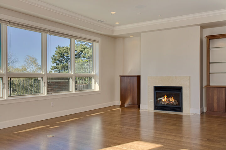 Property Photo: Elegant living and dining room with fireplace 716 Boylston Ave E 12 WA 98102