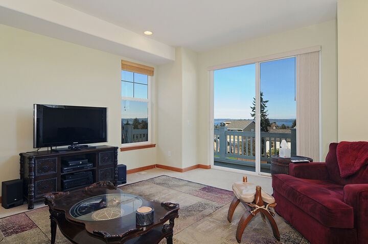 Property Photo: Living room/dining room/kitchen/family room 4840 46th Ave SW WA 98116